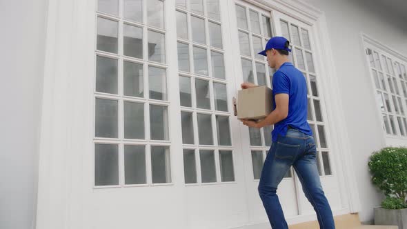 Asian Delivery Man Carry Box Deliver To Customer alt