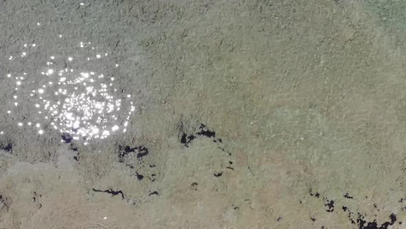 Aerial footage of the beautiful small town known as St George South in the city of Corfu Greece