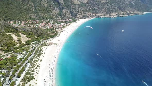 Paragliders Flying Over Sea and Beach on Resort