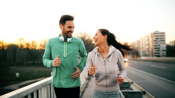 Attractive Man and Beautiful Woman Jogging Together