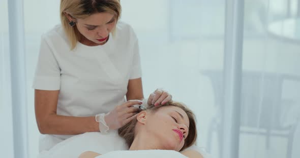 Doctor Trichologist Making Injections Mesotherapy with Vitamins in Woman Skin Head for Hair Growth alt