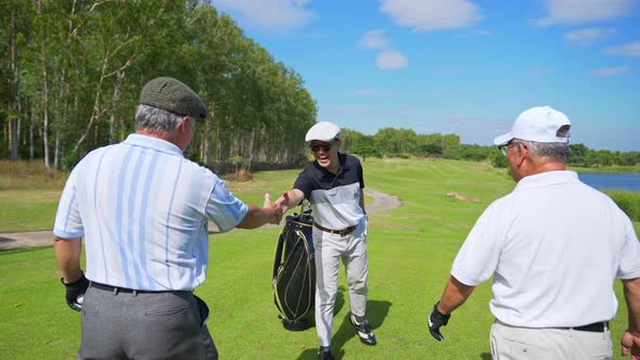 4K Group of Asian people golfer golfing together at country club. alt
