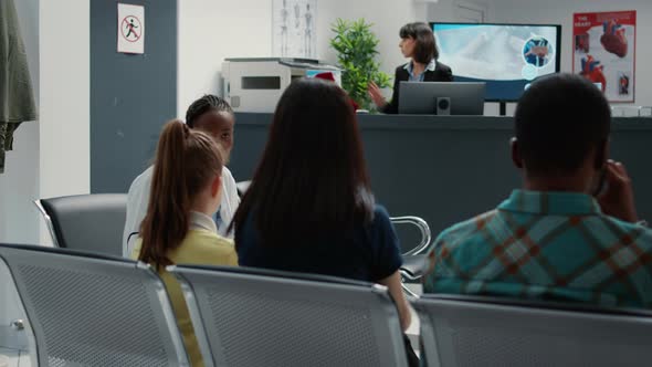 Female General Practitioner Talking to Mother with Little Girl alt