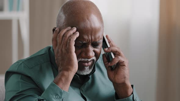 Old Bald African Businessman with Gray Beard Aged Male Client Thinks Speaking on the Phone Remembers alt