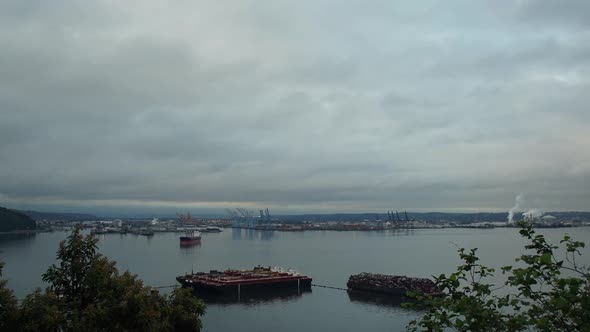 Time Lapse of a cloudy sunrise over the Port of Tacoma, Washington. Seen from Browns Point, rolling alt