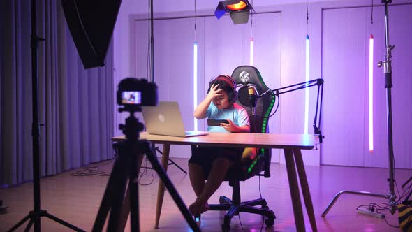 Asian Little Boy Playing Video Game With Mobile Phone Then Lose The Game While Live Stream alt