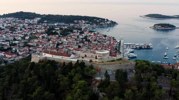 Panoramic View Of Spanish Fortress And Hvar Town In Croatia. aerial alt