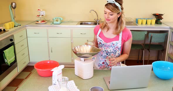 Waitress preparing food while using laptop 4k alt