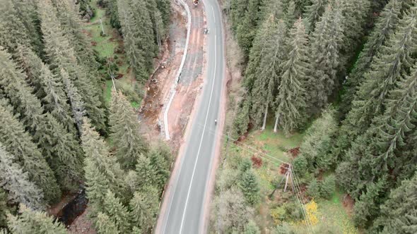 Travel adventures. Cycling. Cyclist riding bicycle on mountain road. alt