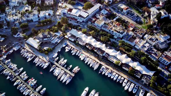 View from drone on full of yachts Bodrum harbour and ancient Kalesi castle in Mugla in Turkey alt