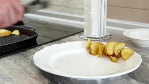 Close Up Laying Out Fried Potato Pieces on White Plate, Simple Side Dish Recipe