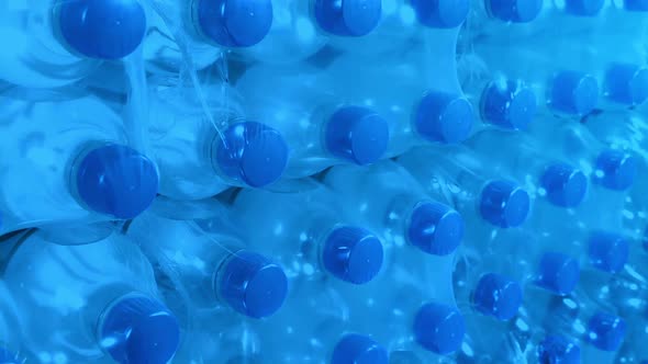 Stacked Packages Of Bottled Water In Storage alt