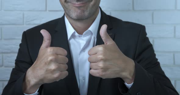 Cheerful Thumbs Gesture in Business alt