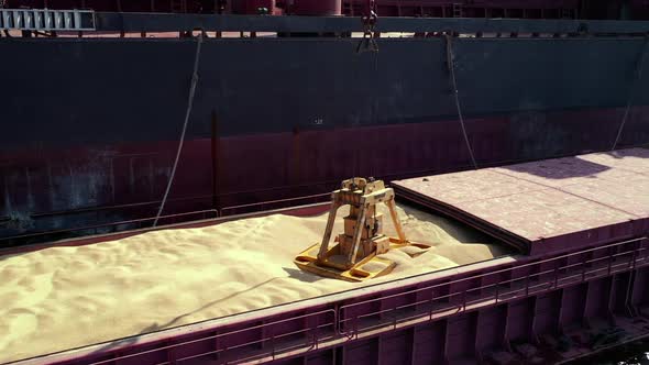 Areal Barge Hold with Soybean Grain or Wheat on Underway Ship to Ship Transfer Operation of Bulk alt