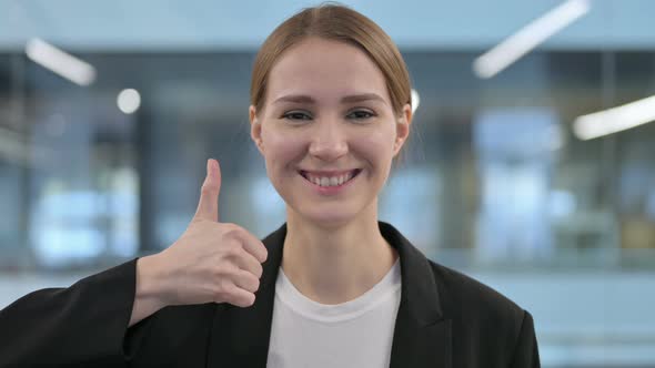 Portrait of Businesswoman Showing Thumbs Up Sign alt