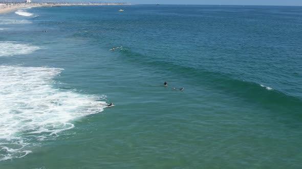 Surfers Paddling Out Aerial