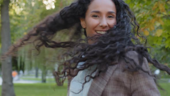 Close Up Back View Active Jumping Moving Dancing Brunette with Curly Hair Girl Model Student alt