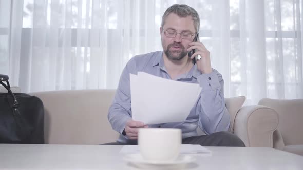 Positive Confident Businessman Talking on the Phone. Portrait of Senior Caucasian Bearded Man in alt