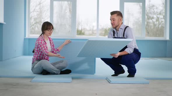 Married Couple Makes Repairs in New Apartment and Puts Insulation on Floor to Lay Laminate alt