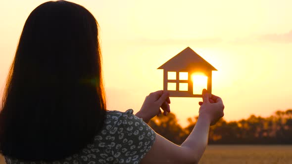 The Silhouette of a House at Sunset alt