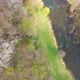 Aerial view of River flowing through the valley of forests - VideoHive Item for Sale