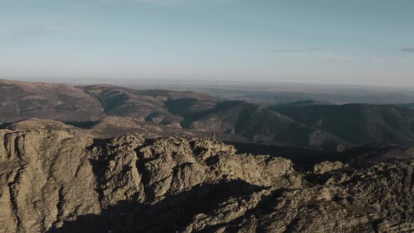 Mountaineer standing on ridge of Puebla de la Sierra Mountains, Spain alt