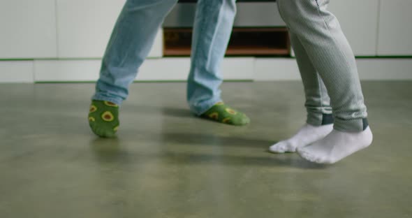Close Up Female and Male Feet, Young Couple Is Dancing in Kitchen alt