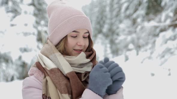 Portrait of Young Beautiful Woman in Winter Snowy Forest alt