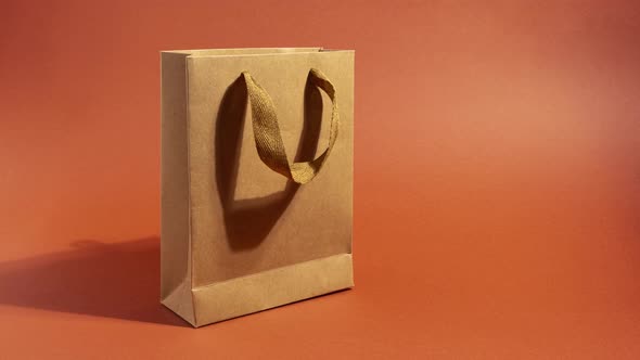 Stop Motion Animation with Craft Paper Shopping Bag with Copy Space