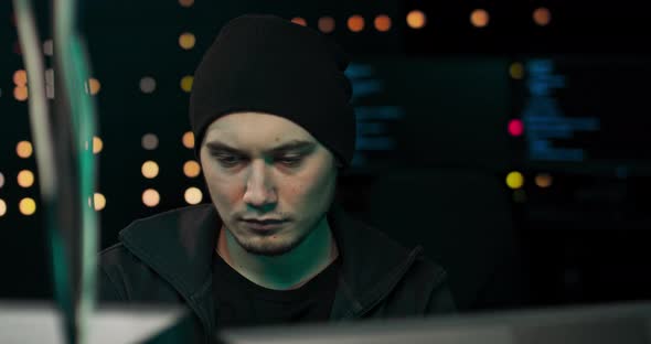 Hacker Coding Virus Ransomware Using Laptops and Computers Hacker Using His Computer with Different alt