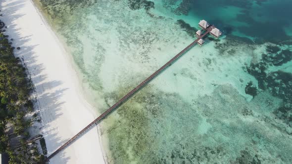 Aerial View of a House on Stilts in the Ocean on the Coast of Zanzibar Tanzania Slow Motion alt