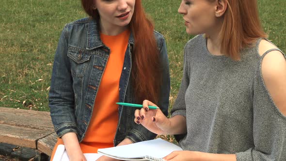 Two Girls Studying Outdoors