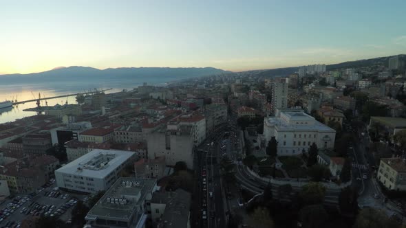 Aerial view of streets and buildings of a city alt