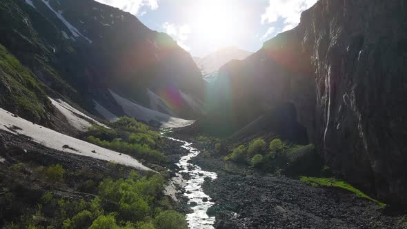 Aerial Flying in the Mountain Canyon with Snow Peak on the Background alt