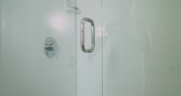 Woman Opening Shower Door alt