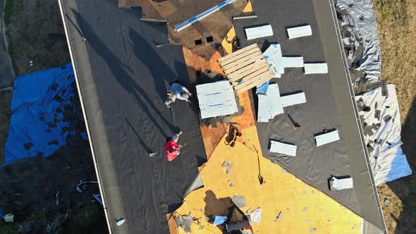 Construction Worker on Renovation Roof the House Installed New Shingles alt