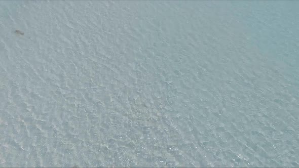 Flying Over the Blue Sea Surface in the Azure Lagoon alt