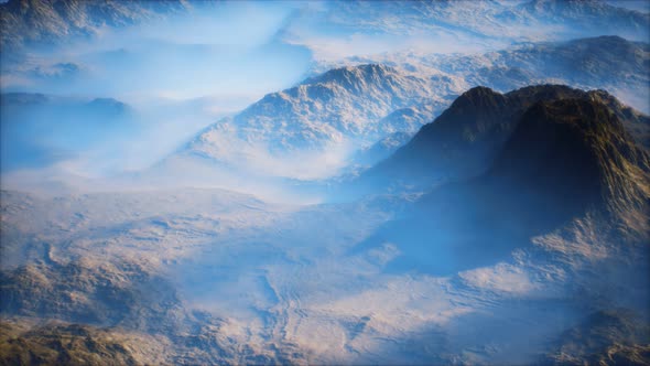 Distant Mountain Range and Thin Layer of Fog on the Valleys alt