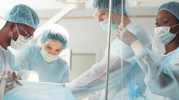 Reconstructive Surgery. Cosmetic Surgery Group Performing Procedure alt