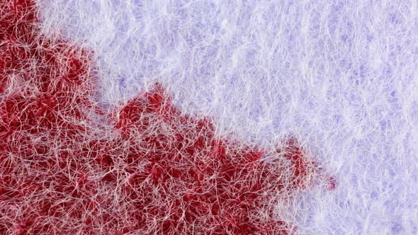 Dripping Ink on fabric. Close up. alt