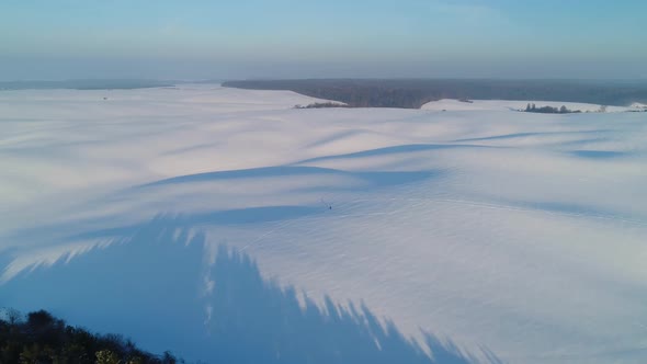 Flight Over Snowcovered Fields