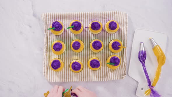 Flat lay. Step by step. Frosting vanilla cupcakes with Italian buttercream icing for Mardi Gras cele alt