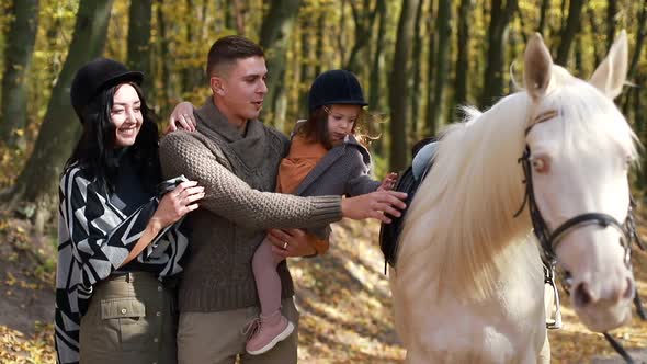 Happy family learning to ride alt