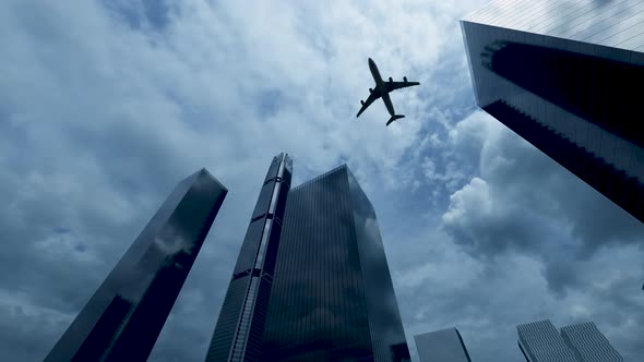 The Plane Flies Over The Buildings alt