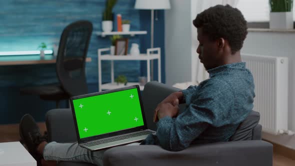 African American Man Working with Chroma Key Isolated Laptop Dispaly alt