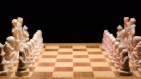 Motion through Chessboard, Hand move forward one pawn, Dolly in alt