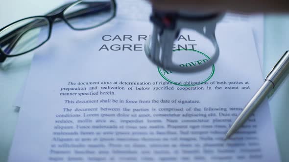 Car Rental Agreement Approved, Officials Hand Stamping Seal on Business Document alt