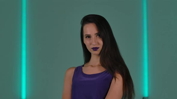 Portrait of Young Stylish Woman Coquettishly Posing for the Camera alt