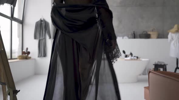 Unrecognizable Young Blond Woman in Beautiful Clothes with Slim Body Walking Toward the Bath alt