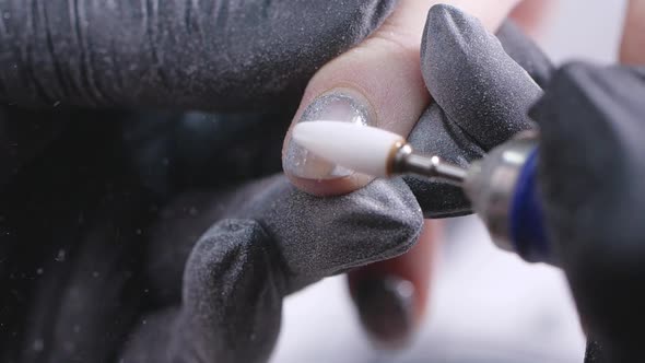 Closeup Slow Motion Shot of Hardware Manicure in a Beauty Salon alt